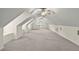 Finished attic with carpet flooring, natural lighting, and dormer windows at 7165 Cr 655, Bushnell, FL 33513