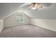Finished attic space with dormer window, neutral carpet, and natural light at 7165 Cr 655, Bushnell, FL 33513
