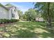 Expansive green backyard area with trees and landscaping at 7165 Cr 655, Bushnell, FL 33513