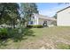 Spacious backyard with lush greenery surrounding the property at 7165 Cr 655, Bushnell, FL 33513