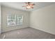 Comfortable bedroom featuring a ceiling fan and windows that let in natural sunlight at 7165 Cr 655, Bushnell, FL 33513