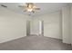 Spacious bedroom featuring neutral paint, plush gray carpet, and a ceiling fan for added comfort at 7165 Cr 655, Bushnell, FL 33513