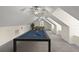 Large game room space with a billiard table, foosball table, and ceiling fans at 7165 Cr 655, Bushnell, FL 33513