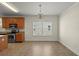 Bright eat-in kitchen features stainless steel appliances, granite countertops, and tile flooring at 7165 Cr 655, Bushnell, FL 33513