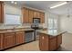 Bright kitchen with island, stainless steel appliances, and spacious countertops at 7165 Cr 655, Bushnell, FL 33513