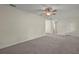 Spacious living room featuring neutral paint, plush carpet, and a ceiling fan at 7165 Cr 655, Bushnell, FL 33513