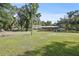 Sprawling property featuring a large grassy area and covered picnic area at 7165 Cr 655, Bushnell, FL 33513