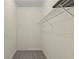 A practical walk-in closet with a wire rack shelf for organization and gray carpeting at 7165 Cr 655, Bushnell, FL 33513