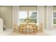 Well-lit dining area featuring a modern oval table, seating for six, and elegant window treatments at 2105 Stake Out Way, Apopka, FL 32703