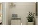 Functional laundry room with shelving, storage bins, a plant, and ample space for organizing essentials at 2105 Stake Out Way, Apopka, FL 32703