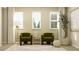 Sitting area with green chairs, neutral rug, large windows, and plenty of natural light at 2105 Stake Out Way, Apopka, FL 32703