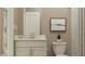 Bright bathroom featuring a toilet, white vanity with stone countertops, and neutral wall tones at 2251 Rider Rain Ln, Apopka, FL 32703