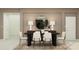 Dining room with a neutral palette, featuring a modern table, six chairs, and stylish decor at 2251 Rider Rain Ln, Apopka, FL 32703