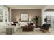 Cozy living room with a comfortable white sectional sofa, modern accents, and a bright, airy atmosphere at 2251 Rider Rain Ln, Apopka, FL 32703