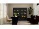 Office space with a desk and chair near a glass display cabinet and two deep red armchairs at 2251 Rider Rain Ln, Apopka, FL 32703