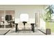 Charming outdoor dining area featuring a modern table, stylish chairs, and a view of the lush landscape at 2251 Rider Rain Ln, Apopka, FL 32703