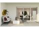 Relaxing outdoor patio area with stylish seating and sliding glass doors leading to the living space at 2251 Rider Rain Ln, Apopka, FL 32703