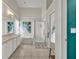 Bright bathroom featuring a double vanity, soaking tub, walk-in shower, and colorful koi art at 2719 Osprey Creek Ln, Orlando, FL 32825