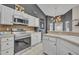 Updated kitchen featuring stainless steel appliances, stylish countertops, and bright lighting at 2719 Osprey Creek Ln, Orlando, FL 32825