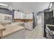 Well-equipped kitchen with stainless steel appliances, white cabinets, and tiled flooring at 2719 Osprey Creek Ln, Orlando, FL 32825