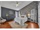 Serene main bedroom featuring an accent wall, ceiling fan, and ample natural light at 2719 Osprey Creek Ln, Orlando, FL 32825
