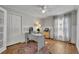 Home office with wood floors, ceiling fan, and lots of natural light at 2719 Osprey Creek Ln, Orlando, FL 32825