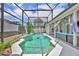 Outdoor swimming pool with an enclosure, patio seating, plants and tiled trim at 2719 Osprey Creek Ln, Orlando, FL 32825
