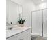 Modern bathroom showcasing a walk-in shower, a sleek vanity, and a minimalist design at 3282 Armstrong Ave, Clermont, FL 34714