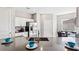 Modern kitchen featuring a large sink, breakfast bar, stainless steel appliances and ample cabinet space at 3282 Armstrong Ave, Clermont, FL 34714