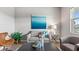Comfortable living room with stylish furniture, modern art, and natural light creating a cozy atmosphere at 3282 Armstrong Ave, Clermont, FL 34714
