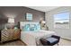 Serene main bedroom featuring a luxurious bed, stylish decor, and plenty of natural light from the window at 3282 Armstrong Ave, Clermont, FL 34714