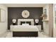 A stylish bedroom featuring a comfortable bed, decorative pillows, and modern nightstands at 463 Puma Loop, Groveland, FL 34736