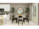 Eat-in kitchen and dining area with a modern white table, black chairs, and sliding glass doors at 463 Puma Loop, Groveland, FL 34736