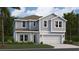 Charming two-story home featuring a light gray exterior, well-manicured lawn and attached two car garage at 463 Puma Loop, Groveland, FL 34736