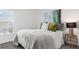 Cozy bedroom with a comfortable bed, stylish decor, and a bright window at 5611 Vinyasa Rd, Clermont, FL 34714