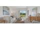 Bright living room with neutral tones, sliding glass doors, and stylish decor at 5611 Vinyasa Rd, Clermont, FL 34714