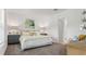 Inviting main bedroom with decorative lamps, a large bed, and soothing neutral tones at 5611 Vinyasa Rd, Clermont, FL 34714