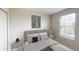 Serene bedroom with a comfortable bed, soft lighting, and a window offering a peaceful retreat at 5615 Vinyasa Rd, Clermont, FL 34714