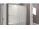 Bright bathroom featuring a tiled shower and a white shower curtain for privacy at 5660 Vinyasa Rd, Clermont, FL 34714