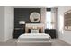Serene primary bedroom featuring soft lighting, a comfortable bed, and stylish decor at 5660 Vinyasa Rd, Clermont, FL 34714
