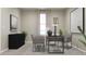 Well-lit office space featuring neutral tones and modern desk with chairs with a large window at 5660 Vinyasa Rd, Clermont, FL 34714