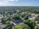Areal view of home and neighborhood with lush greenery at 1205 Crestwood Dr, Winter Haven, FL 33881
