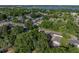 Aerial view of home with mature landscaping in residential neighborhood at 1205 Crestwood Dr, Winter Haven, FL 33881