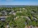 Aerial view of a cozy neighborhood near a serene lake at 1205 Crestwood Dr, Winter Haven, FL 33881