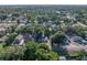 Birds eye shot of home in residential neighborhood with many trees at 1205 Crestwood Dr, Winter Haven, FL 33881