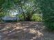 Large backyard features mature trees, providing shade and privacy at 1205 Crestwood Dr, Winter Haven, FL 33881