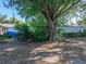 Large backyard provides a serene environment with mature trees at 1205 Crestwood Dr, Winter Haven, FL 33881