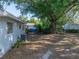 Expansive backyard with mature trees, offering ample space and landscaping opportunities at 1205 Crestwood Dr, Winter Haven, FL 33881