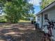 Large backyard with mature trees and exterior building, a peaceful outdoor setting at 1205 Crestwood Dr, Winter Haven, FL 33881
