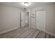 Bedroom with closet space and wood-look floors, offering a cozy and functional space at 1205 Crestwood Dr, Winter Haven, FL 33881
